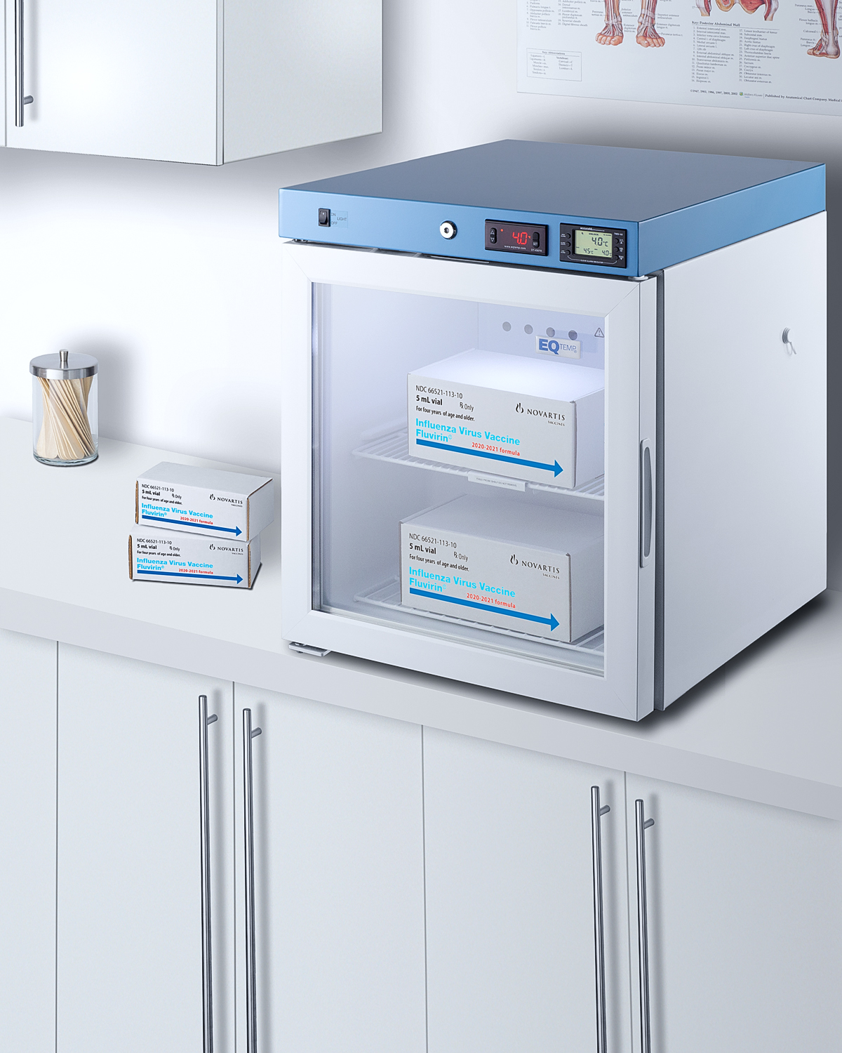 Compact healthcare all-refrigerator with self-closing glass door, front lock, digital controls, and external temperature readout.